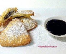 RAVIOLI AL CIOCCOLATO CON SALSA AI MIRTILLI.